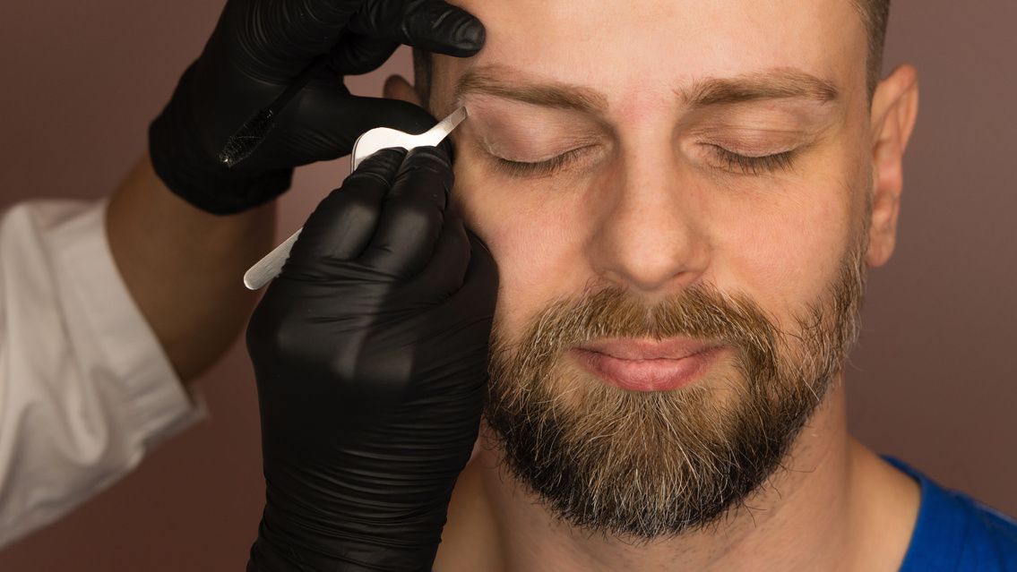 Correcting Shape of the Eyebrow of a  Male Client